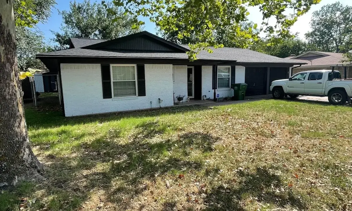 Professional roofing crew working on a residential roof in North Elba